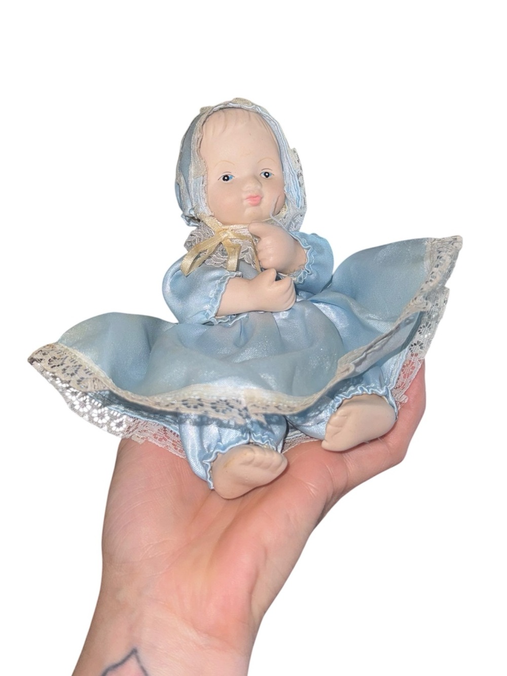 Vintage cloth and porcelain doll in blue dress